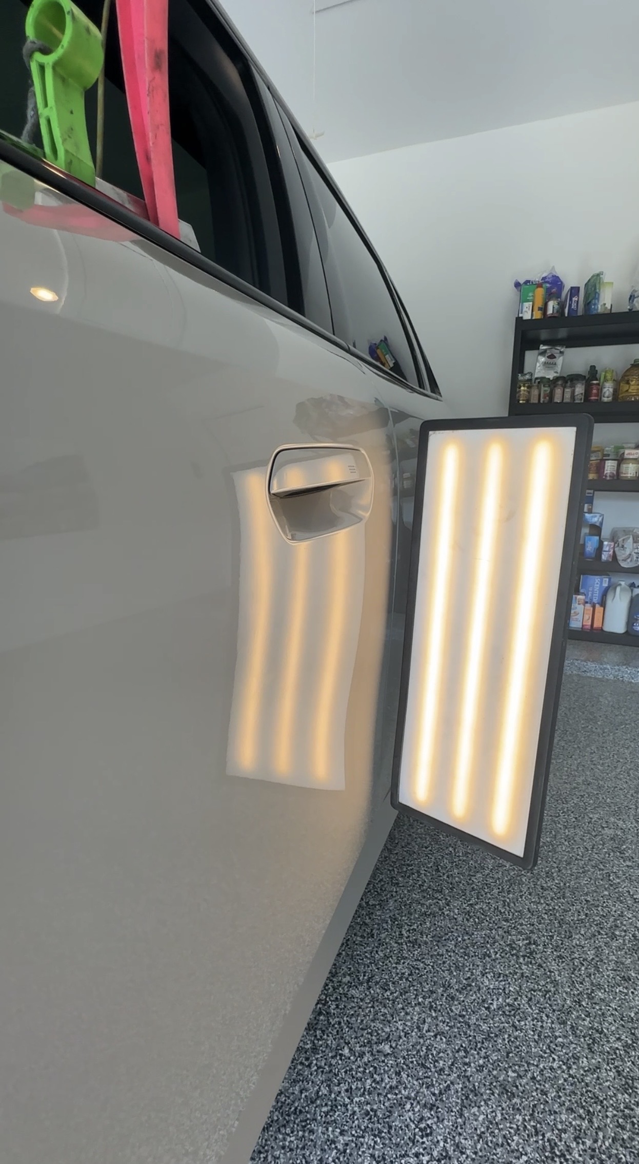 After photograph showing the completed Divine Dents mobile door-handle dent repair. Because a support brace blocked access behind the panel, the dent was restored using careful glue pulling instead of conventional backside tool access. The advertised $149 special was honored for this customer.